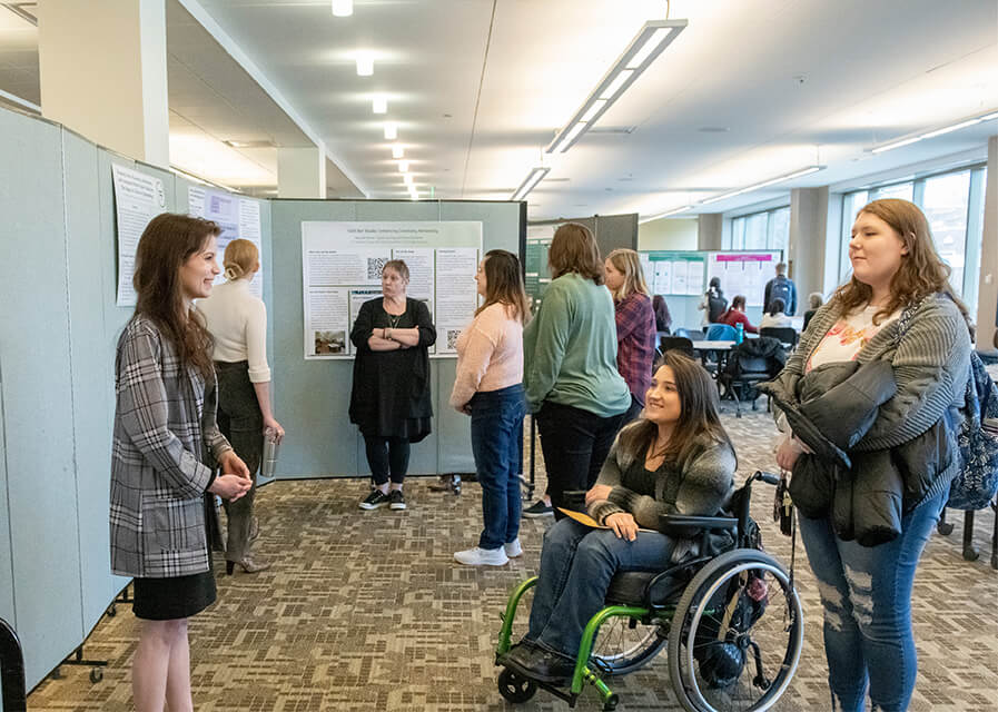 A student presents her work to other students during the annual Undergraduate Research Forum